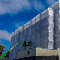 Environmental inspector examining structural conditions and safety risks during a property inspection in Los Angeles, California.